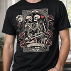 Person wearing a black t-shirt with a skeleton design and 'The Lovers' tarot card illustration.